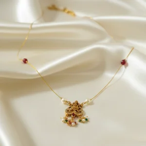 dainty lakshmi "invisible" chain pendant with ruby & pearl accents | ka treasure hub
